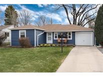Charming blue single-story home with a well-manicured lawn and inviting front porch at 5178 S Sherman St, Littleton, CO 80121