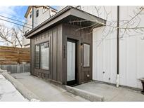 Modern home exterior with dark brown accents and a sleek design at 3955 W 13Th Ave, Denver, CO 80204