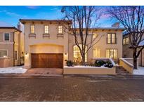 Charming two-story home featuring an attached garage and well-manicured landscaping at 100 S University Blvd # 11, Denver, CO 80209