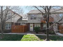 Charming townhome featuring well-maintained front yard, brick accents, and a cozy fenced-in patio area at 1381 W 112Th Ave # B, Westminster, CO 80234