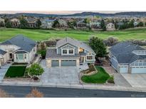 Charming two-story home with a well-manicured lawn and a three-car garage in a quiet neighborhood at 1497 Bent Grass Cir, Castle Rock, CO 80109