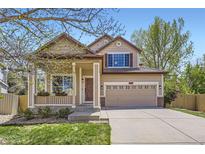 Charming two-story home with a manicured lawn, covered porch and a two car garage at 3744 Gypsum Ct, Superior, CO 80027
