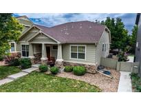 Charming one-story home boasts stone accents, covered entry, and well-maintained landscaping at 14230 Lakeview Ln, Broomfield, CO 80023