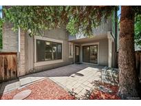 Charming patio area with new stone pavers and wood accents perfect for entertaining or relaxing outdoors at 1219 S Yosemite Way # 63, Denver, CO 80247