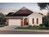 Charming single-story home featuring a brick accent wall, a two-car garage, and a covered front porch at 8664 S Quemoy St, Aurora, CO 80016
