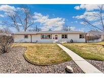 Charming single-story home featuring a well-maintained lawn and a welcoming walkway to the front door at 8840 Hooker Way, Westminster, CO 80031