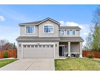 Charming two-story home with a well-manicured lawn and a spacious two-car garage at 21005 Glacier Park Cv, Parker, CO 80138