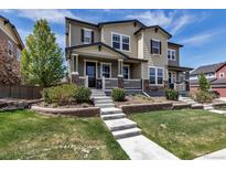 Charming two-story home features a welcoming front porch, stone accents, and well-manicured landscaping at 3429 Hardin St, Castle Rock, CO 80109