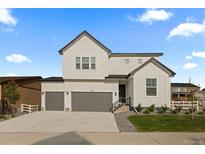 Beautiful modern farmhouse with a three-car garage and eye-catching curb appeal at 4739 Gray Wolf Ln, Castle Rock, CO 80104