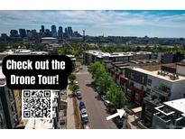 Drone shot of modern townhomes with a skyline view and street access at 2650 W Front View Crescent Dr # 101, Denver, CO 80211