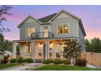 Charming two-story home with a welcoming front porch and beautiful landscaping at 3256 S Corona, Englewood, CO 80113