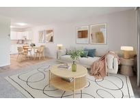 Bright living room with stylish furnishings and an open layout at 635 S Alton Way # 1C, Denver, CO 80247