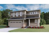 Charming two-story home featuring mixed siding, stone accents, attached two-car garage, and a welcoming front porch at 1362 Rock Cliff Ave, Erie, CO 80516
