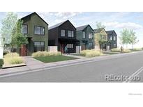 Modern homes line the street, showcasing unique architectural designs and tidy front yards at 777 E County Line Rd, Erie, CO 80516