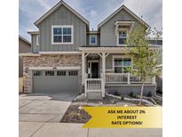 Charming two-story home featuring a welcoming front porch, stone accents, and a well-manicured front yard at 2089 S Fultondale Way, Aurora, CO 80018