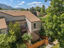 Charming condo with a cozy, fenced-in front yard and mature trees, offering a tranquil setting at 4717 Tantra Dr # G5, Boulder, CO 80305