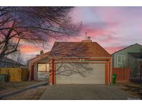 Charming single Gathering home with a two car garage and low maintenance yard at 17949 E Ohio Cir, Aurora, CO 80017