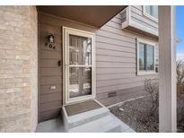 Inviting entryway with a charming screen door and visible house number at 804 Summer Dr, Highlands Ranch, CO 80126