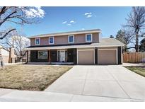 Charming two-story home featuring a two car garage and neutral exterior color palette at 3232 S Leyden St, Denver, CO 80222
