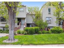 Charming townhomes with a well-manicured lawn and mature landscaping, creating an inviting curb appeal at 345 Harrison St, Denver, CO 80206