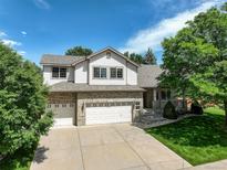 Charming two-story home features a well-manicured lawn and a three-car garage at 14910 Williams St, Thornton, CO 80602