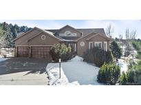 Two-story house with attached two-car garage and landscaping at 1535 Plowman Dr, Monument, CO 80132