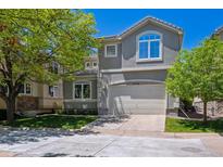 Two-story home with a well-manicured lawn and a two-car garage at 11969 E Lake Cir, Greenwood Village, CO 80111