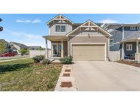 Charming two-story home featuring a two-car garage and a well-maintained lawn with manicured landscaping at 4405 Walden Ct, Denver, CO 80249