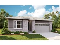 Charming single-story home with light gray brick, side siding, and a two-car garage, nestled in a lush green landscape at 6974 E 126Th Dr, Thornton, CO 80602