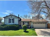 Charming single-Gathering home with a well-manicured lawn and attached two car garage at 12622 W Radcliff Ave, Morrison, CO 80465