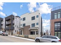 Modern two-story home featuring clean lines, neutral colors, and stylish architectural details at 1252 Yates St, Denver, CO 80204