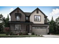 Charming two-story home featuring a stone facade, a covered front porch and a two car garage at 7444 S Yank Ct, Littleton, CO 80123
