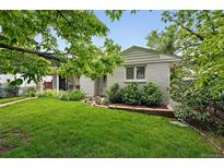 Charming home exterior features lush lawn and lovely landscaping at 11 S Albion St, Denver, CO 80246