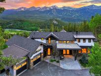 Stunning mountain home with stone accents, a three-car garage, and breathtaking views at 2300 Boreas Pass Rd, Breckenridge, CO 80424