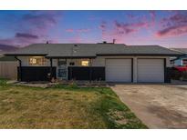 Charming single-story home with a well-manicured lawn and an attached two-car garage at 8191 Tennyson St, Westminster, CO 80031