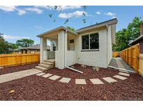 Beautiful exterior with white brick, landscaping, nice porch, and walkway leading to the front door at 3346 W 33Rd Ave, Denver, CO 80211