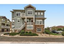 Beautiful multi-level condo with stone accents and a private balcony, blending style and outdoor living at 9363 Amison Cir # 106, Parker, CO 80134