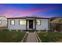 Charming single-story home boasts an updated front exterior with meticulous landscaping and welcoming curb appeal at 739 S Utica St, Denver, CO 80219