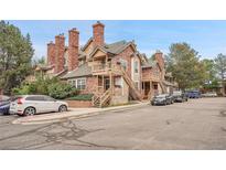 Charming brick and wood townhouse exterior with multiple levels and private entrances at 4923 S Carson St # 210, Aurora, CO 80015