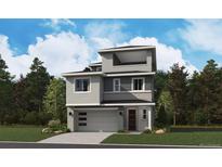 This modern two-story home features a two-car garage and stylish gray and white exterior at 8213 Butte Creek St, Littleton, CO 80125