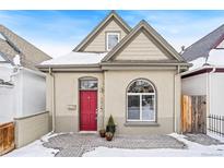 Charming craftsman home with red door and brick walkway at 1342 Lipan St, Denver, CO 80204