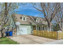 Charming home featuring an attached garage, well-kept lawn, and lovely curb appeal at 1065 6Th St, Berthoud, CO 80513