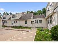 Charming home with a well-maintained lawn and a light yellow door at 272 S 22Nd Ave, Brighton, CO 80601