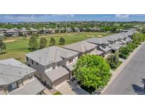 Aerial view of houses with a golf course nearby at 3211 Westbrook Ln, Highlands Ranch, CO 80129