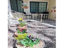 A view of the patio with decorative potted plants and a table and chairs at 4878 E Kentucky Ave # A, Denver, CO 80246