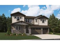 Charming two-story home featuring a covered porch, shake siding, three-car garage and mature landscaping at 8644 Pennycress Dr, Littleton, CO 80125