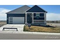Charming single-story home showcasing a pristine front yard and attached garage, perfect for comfortable living at 42998 Colonial Trl, Elizabeth, CO 80107