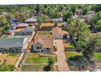 Charming home with a large backyard and detached garage, perfect for outdoor living and storage at 2226 Fulton St, Aurora, CO 80010
