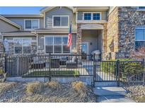 Charming townhome with a fenced front patio perfect for relaxing outdoors at 1897 S Buchanan Cir, Aurora, CO 80018