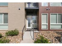Inviting exterior featuring a modern design, brick accents, stone landscaping, and a well-maintained entrance at 8475 E 36Th Ave # 131, Denver, CO 80238
